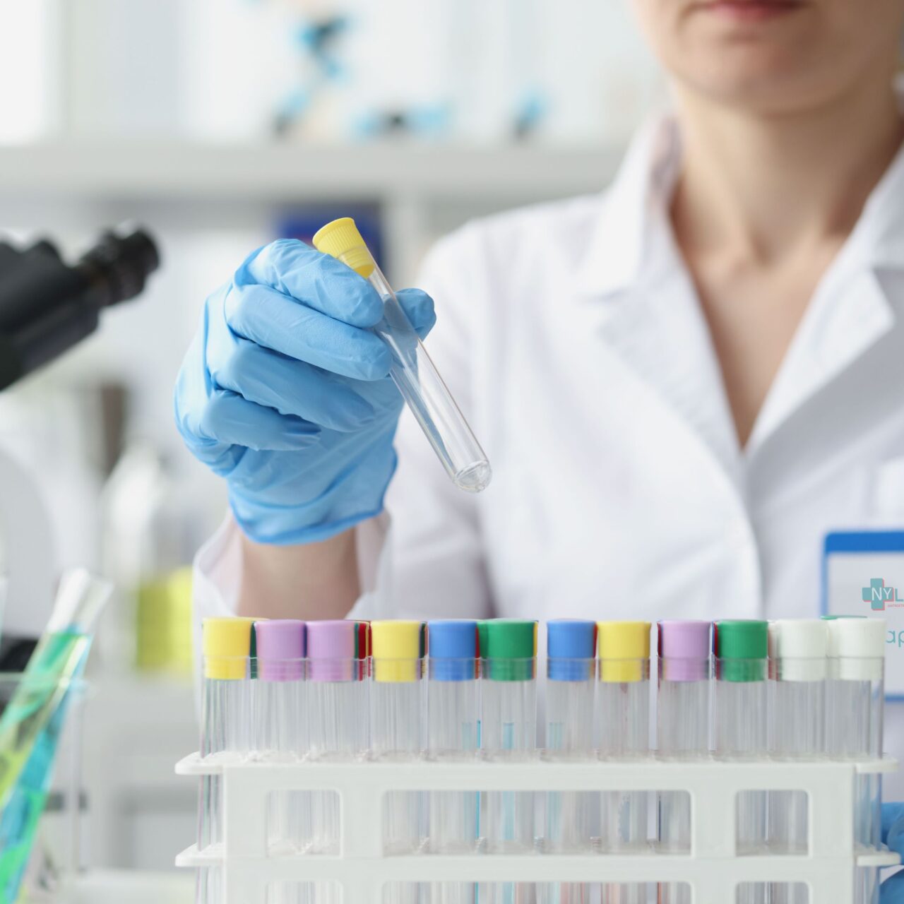 Scientist holds empty test tube in gloves in laboratory Scientist holds empty test tube in gloves in laboratory. Laboratory research methods in medical laboratory concept